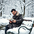 Poetry: In the hush of winters white embrace, A bench cradles souls in snows soft lace. Coats of...